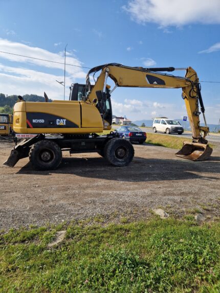 Koparka kołowa Cat 315 D
